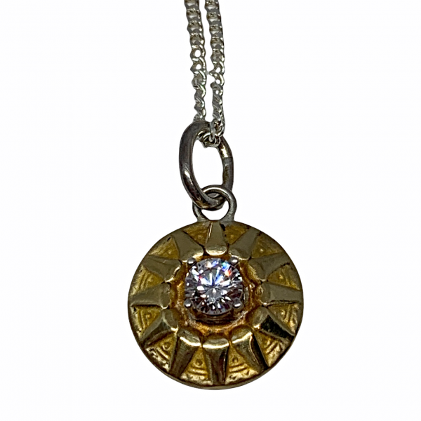 Handmade sterling silver, bronze, and CZ sundial necklace by Karyn Chopik | Effusion Art Gallery + Cast Glass Studio, Invermere BC
