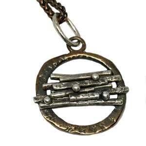 Sterling and bronze pendant by Karyn Chopik | Effusion Art gallery + Cast Glass Studio, Invermere BC