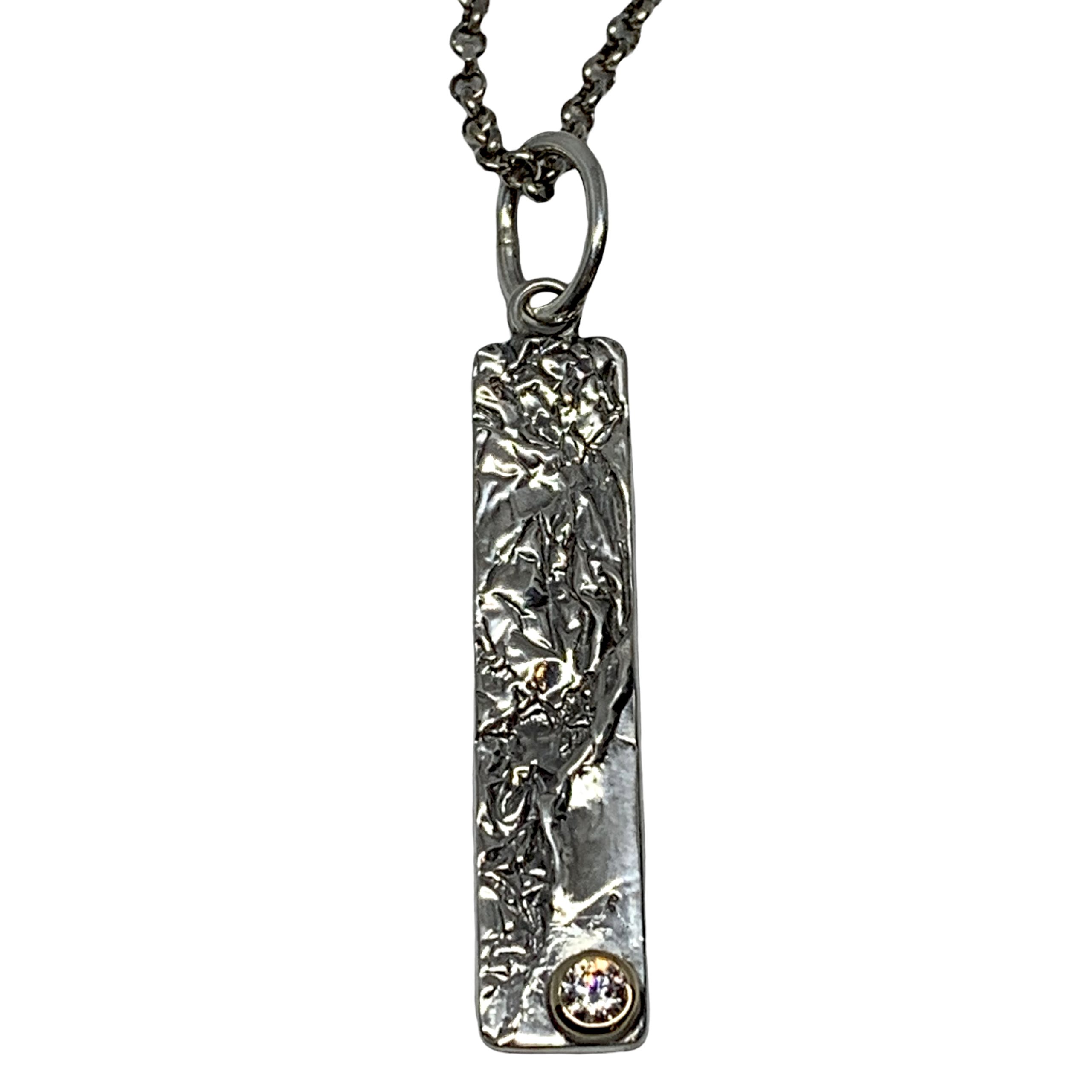 Handmade sterling silver, bronze, and CZ pendant by Karyn Chopik | Effusion Art Gallery + Cast Glass Studio, Invermere BC