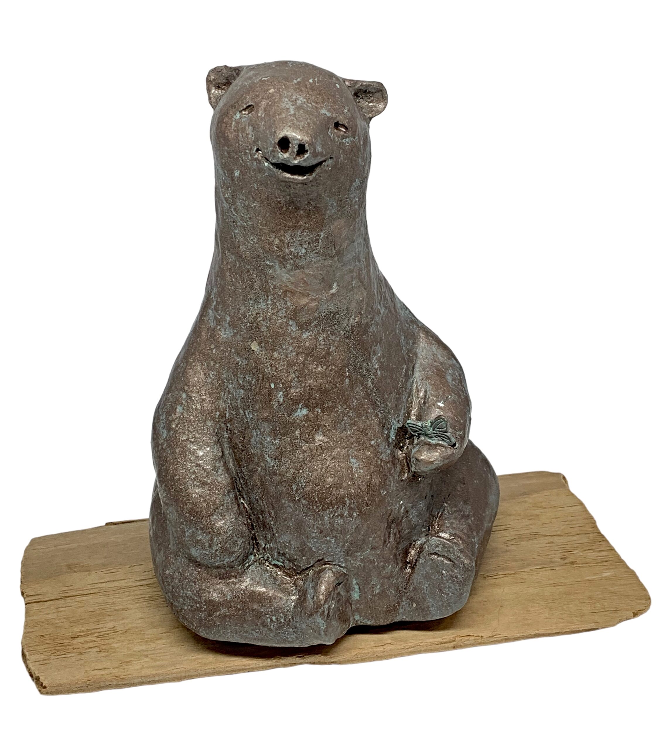 Mixed media sculpture of a bear sitting on a yoga mat by Karin Taylor.