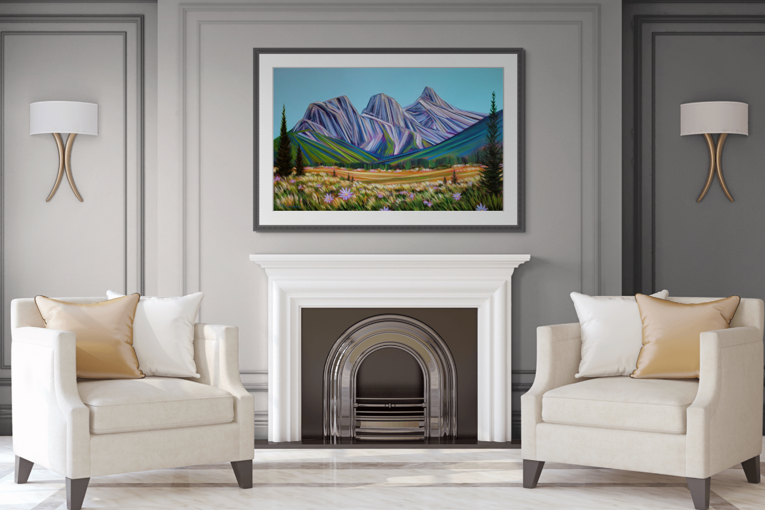 Framed painting of the Three Sisters mountains in Canmore in the summer by Kayla Eykelboom above a modern white and pewter fireplace with two beige chairs.