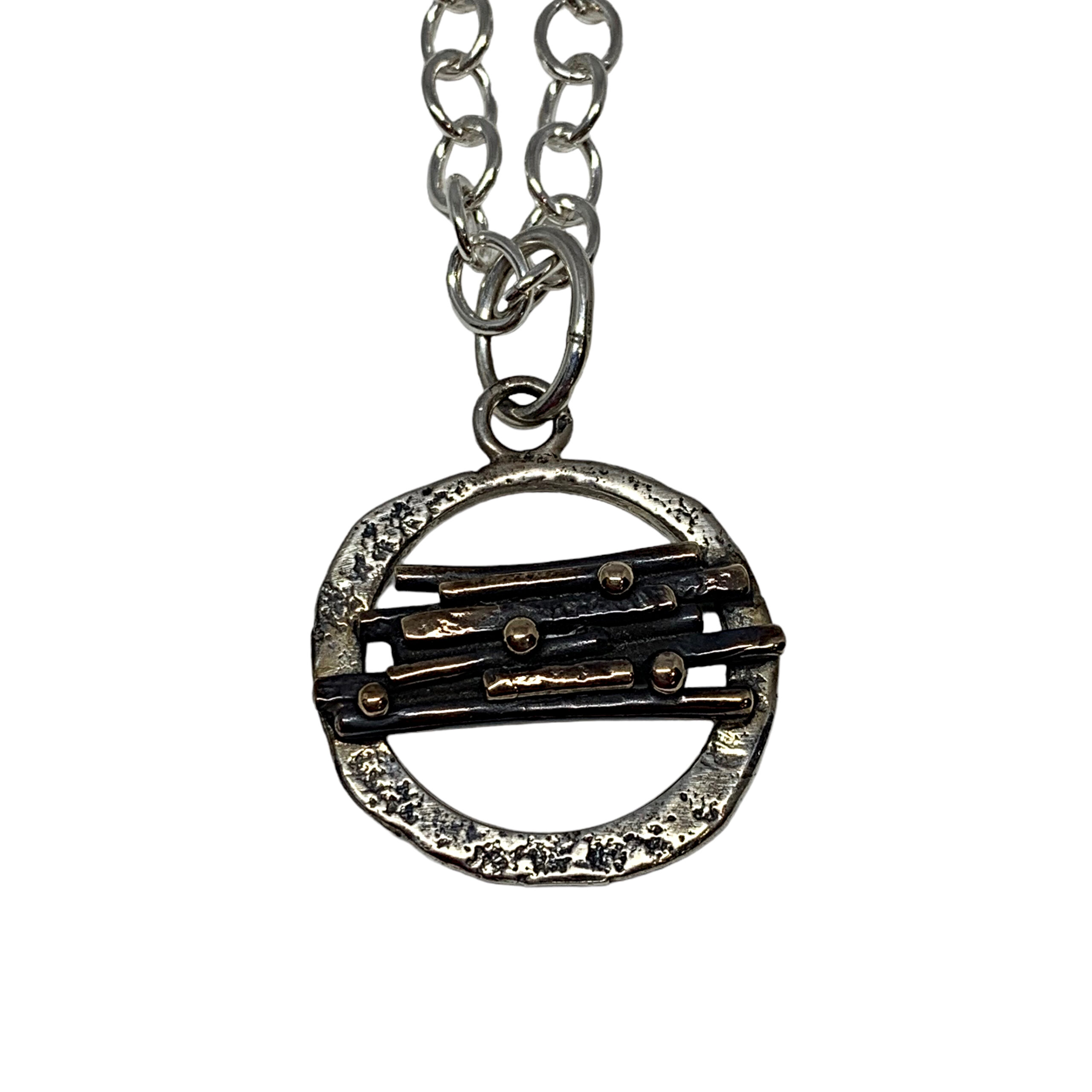 Handmade sterling silver and bronze pendant by Karyn Chopik | Effusion Art Gallery, Invermere, BC