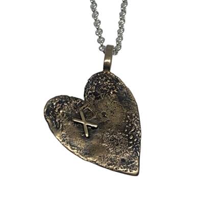 Sterling silver + bronze heart necklace by Karyn Chopik at Effusion Art Gallery in Invermere, BC.
