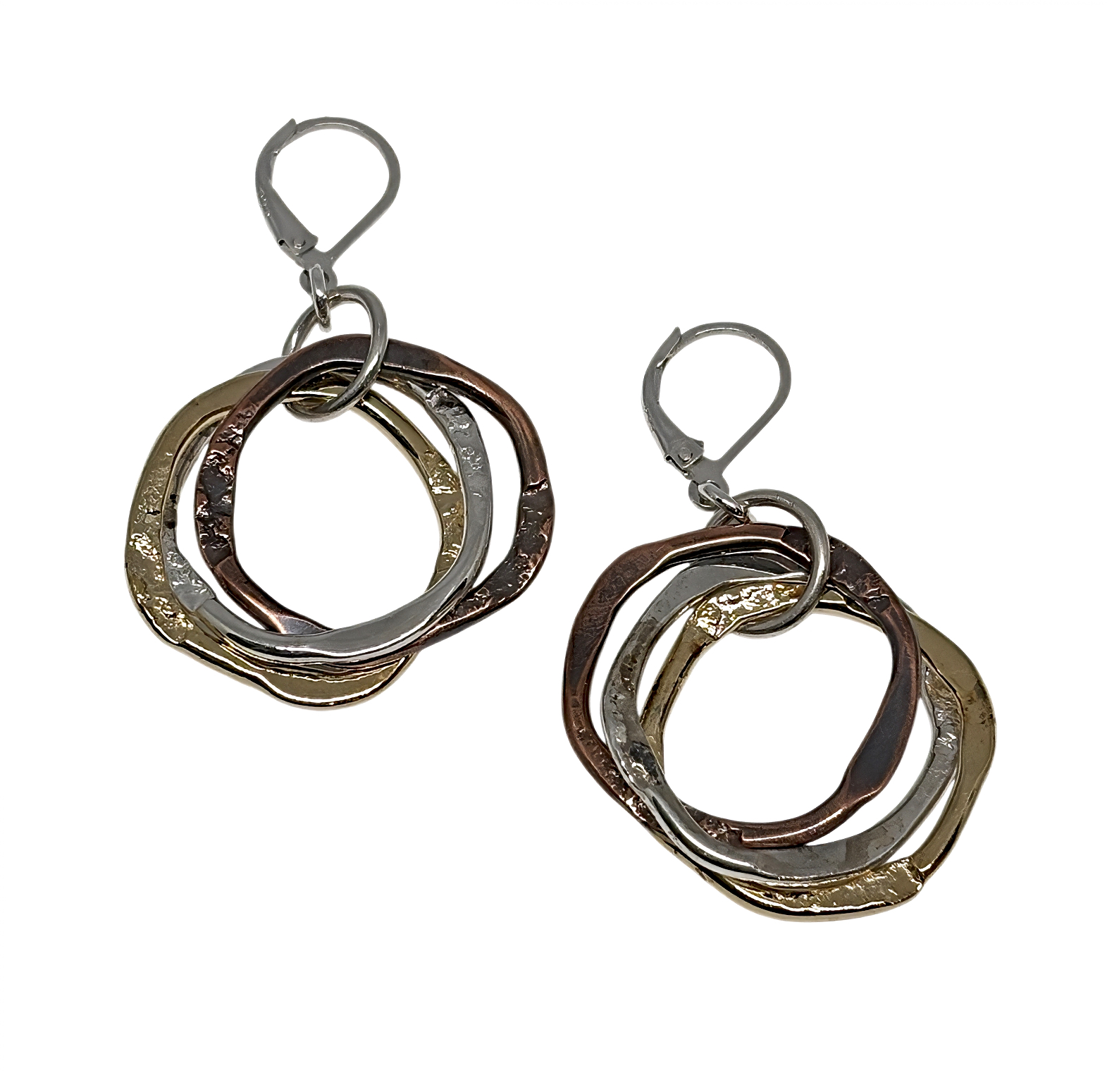 Handmade sterling silver, copper, and bronze earrings by Canadian artist Karyn Chopik at Effusion Art Gallery in Invermere, BC.