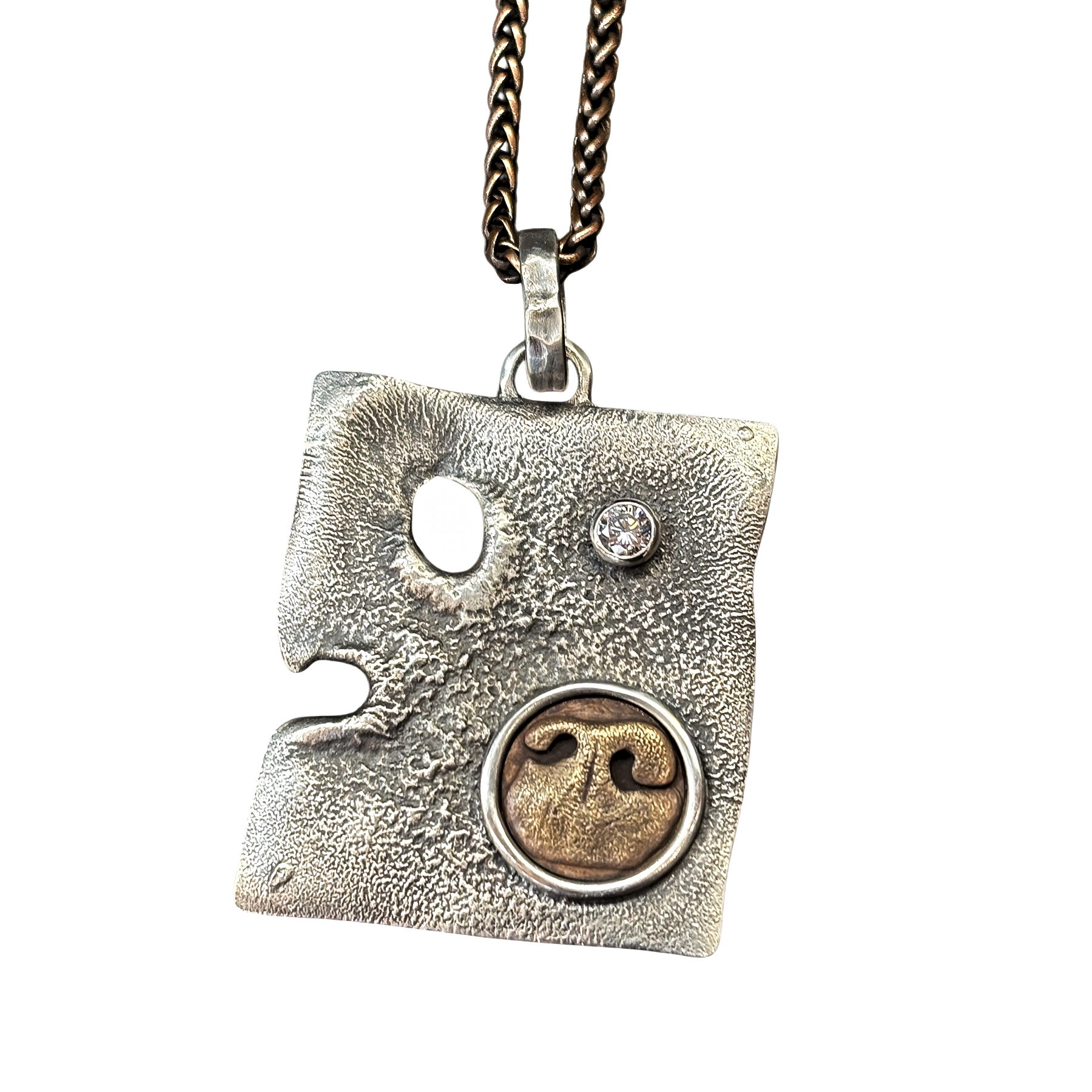 Willow Pendant, custom sterling silver pendant with a bronze cast impression of her sweet dog's nose print by Canadian jewelry artist Karyn Chopik | Effusion Art Gallery, Invermere, BC.